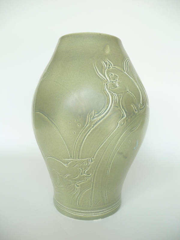 Lot 1812 - A Susie Cooper Earthenware Vase, decorated with incised squirrels on a matt green ground,...
