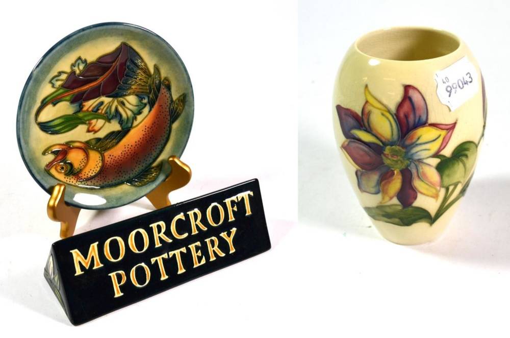 Lot 7 - A modern Moorcroft pottery Trout pattern plate; a Moorcroft name plaque; and a Clematis pattern...