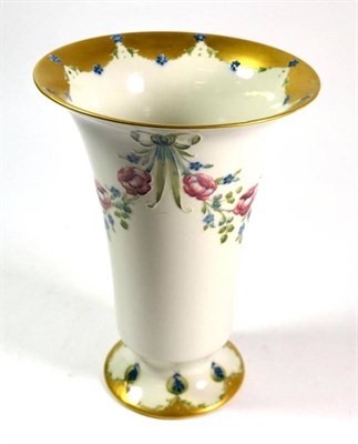 Lot 8 - A William Moorcroft for Macintyre trumpet vase decorated with floral swags and gilt rims, signed in