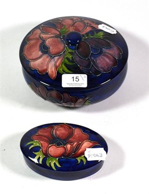 Lot 15 - A Moorcroft pottery Anemone pattern jar and cover, painted and impressed marks, 18cm diameter;...