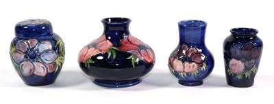 Lot 20 - Three Moorcroft Anemone pattern pottery vases; and a similar ginger jar and cover, the tallest...