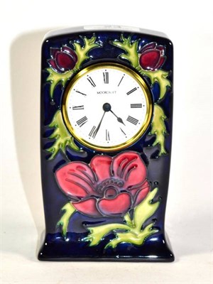 Lot 23 - A Moorcroft pottery Anemone pattern timepiece, impressed and painted marks, 16cm high