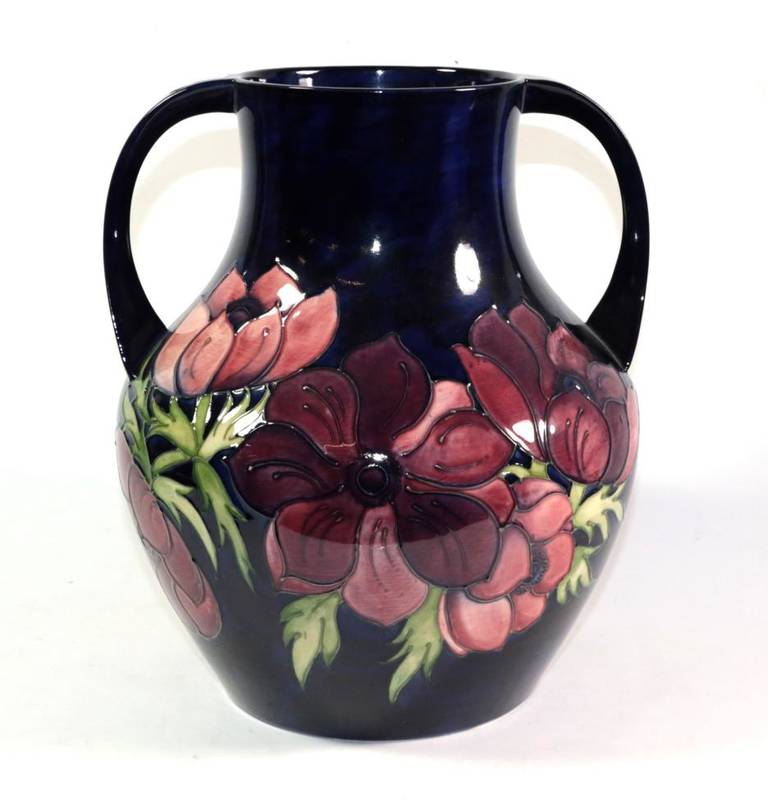 Lot 23 - A Moorcroft pottery Anemone pattern twin-handled vase, with painted and impressed marks, 33cm