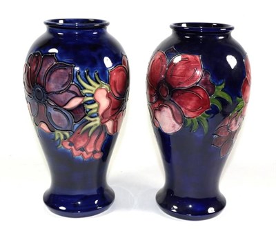 Lot 26 - A pair of Moorcroft pottery Anemone pattern vases, one with painted and impressed marks, the...