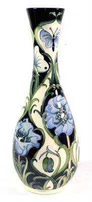 Lot 27 - A modern Moorcroft pottery vase decorated with florian blue poppy style design, limited edition...