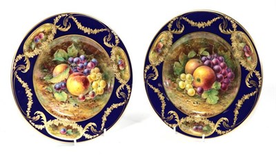 Lot 32 - A pair of T G Abbotts for Lynton Porcelain fruit painted plates, signed, 27cm