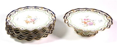 Lot 33 - A Royal Crown Derby porcelain part dessert service, 1908, painted with flowersprays within blue and