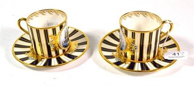 Lot 41 - A pair of Stephen D Nowacki cups and saucers, painted with ships, on a stripe ground, cups 6cm