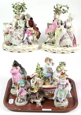 Lot 43 - A pair of Continental porcelain figure groups of seated courting couples; together with six...