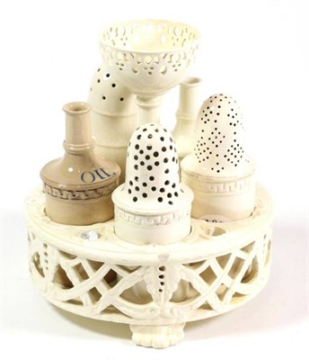 Lot 58 - A Wedgwood creamware cruet stand, circa 1820, with five compartments above a pierced basketwork...