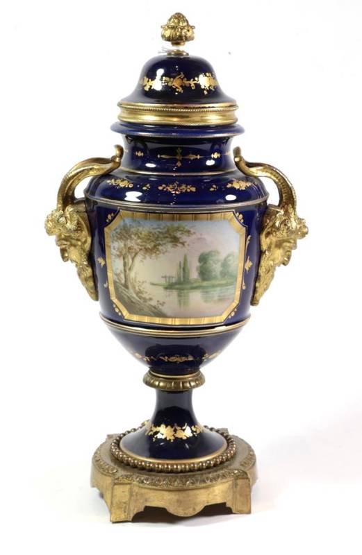 Lot 64 - A gilt metal mounted Sèvres style porcelain urn shaped vase and cover, with Bacchus mask...