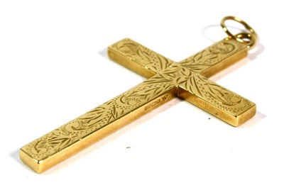 Lot 71 - A 9 carat gold cross pendant with engraved floral decoration, 7cm by 4cm