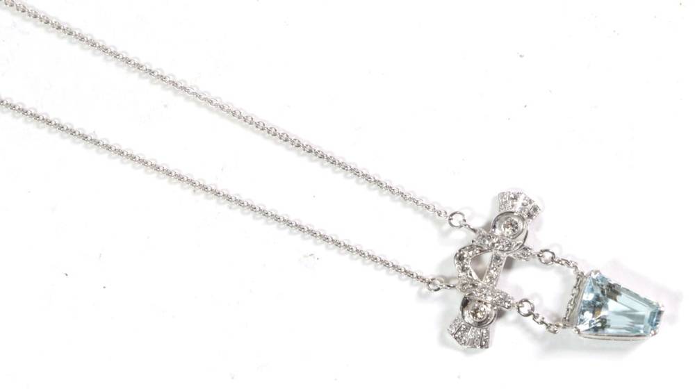 Lot 74 - An Art Deco aquamarine and diamond pendant, on chain, a grain set old cut diamond scroll suspends a