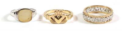 Lot 83 - A 9 carat gold Claddagh ring, finger size N; a 9 carat white gold signet ring, finger size M; and a