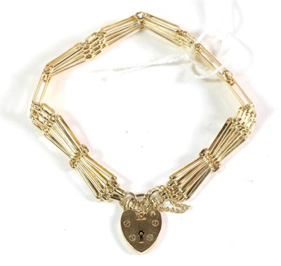 Lot 89 - A 9 carat gold gate bracelet with padlock, length 19cm