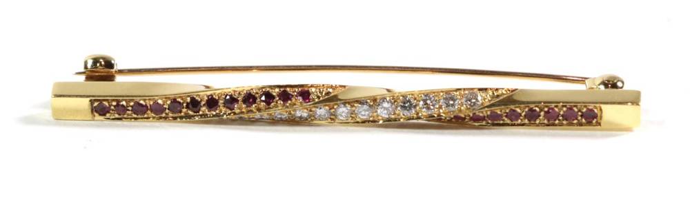 Lot 90 - An 18 carat gold diamond and ruby bar brooch, length 5.5cm