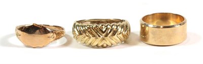 Lot 91 - A 9 carat gold band ring, finger size J; a signet ring, finger size N; and another ring,...
