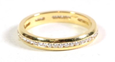 Lot 111 - An 18 carat gold channel set diamond eternity ring, total estimated diamond weight 0.45 carat...