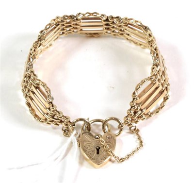 Lot 124 - A 9 carat gold gate link bracelet, with a 9 carat gold padlock clasp, length 17cm