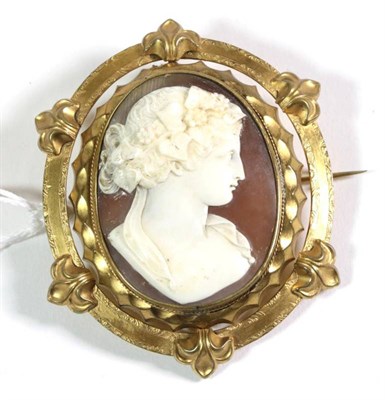 Lot 129 - A Victorian cameo brooch, depicting the bust of a Bacchante, in a gilt metal frame, measures 8cm by