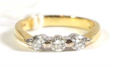 Lot 141 - An 18 carat gold three stone diamond ring, total estimated diamond weight 0.45 carat approximately