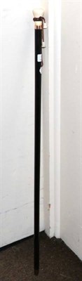 Lot 185 - An ebony walking cane, with 9 carat gold collar and ivory knop, London 1924