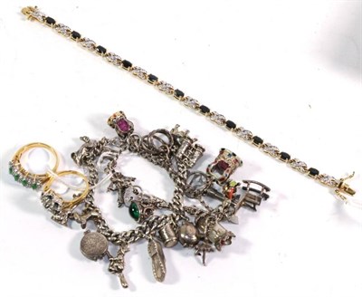 Lot 309 - Two silver charm bracelets hung with various charms including an elephant, a dog, binoculars...