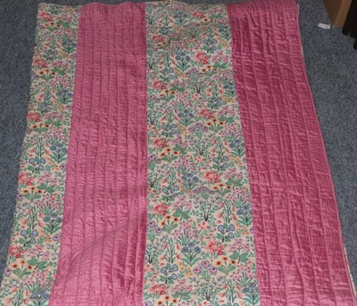Lot 1022 - Circa 1930s pink striped and cotton floral strippy quilt with spotty printed cotton reverse,...