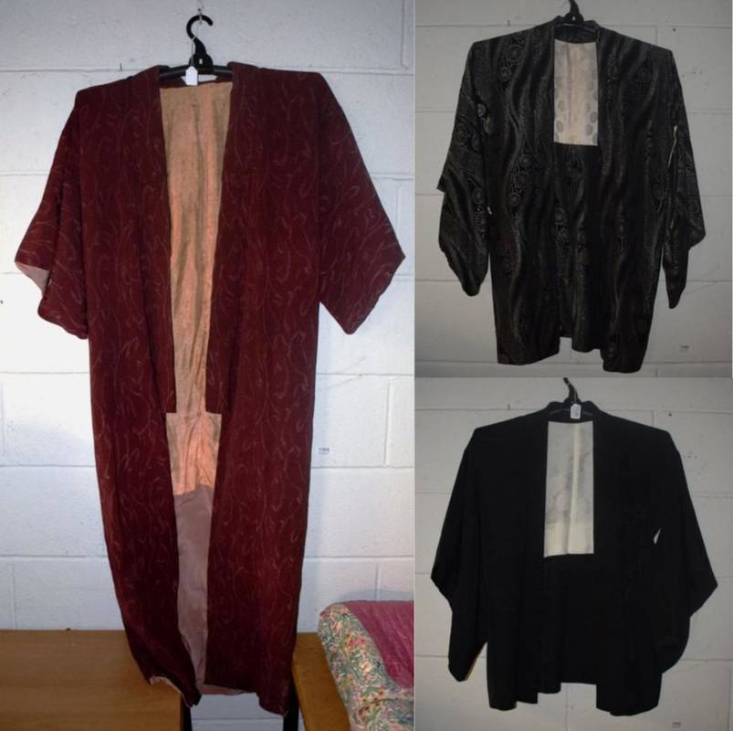 Lot 1035 - Black and silver Japanese Happi coat and another in black silk;  and a Japanese kimono in a...