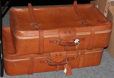 Lot 1044 - Pair of Harrods tan leather suitcases, each embossed with initials A.A, the interior with...