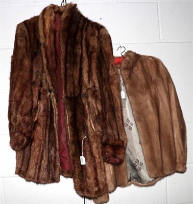 Lot 1055 - A short light brown mink jacket together with another (2)