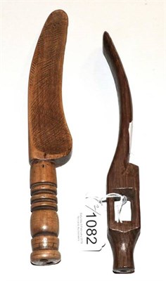 Lot 1082 - 19th century knitting sheath with carved cage, another in gull wing shape with turned handle (2)