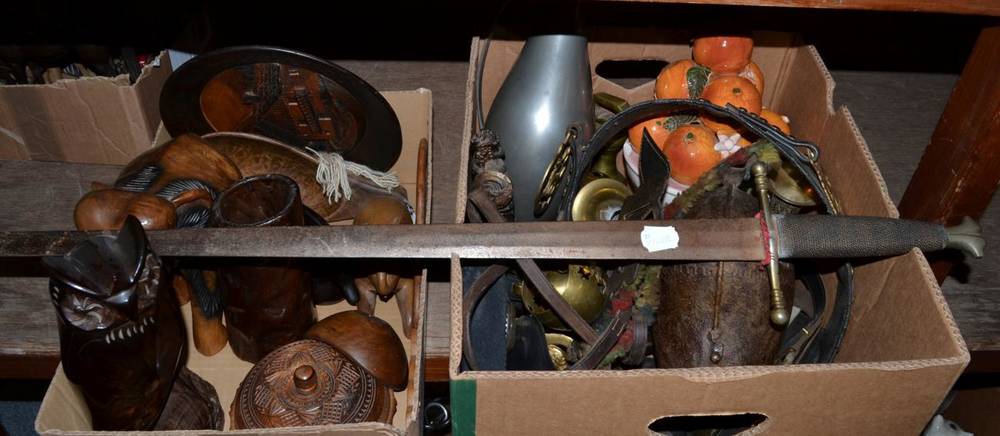 Lot 1180 - Four boxes including horse brasses, wooden carvings, reproduction knifes, reproduction sword etc