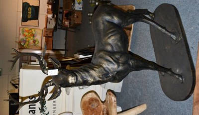 Lot 1200 - A pair of large patinated bronzed stags