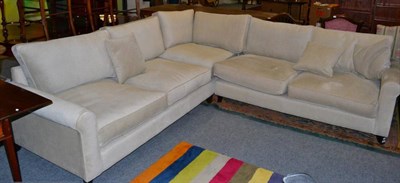 Lot 1211 - A modern corner settee upholstered in oatmeal coloured fabric