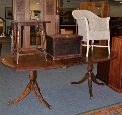 Lot 1214 - A reproduction twin pillar dining table; a carved oak occasional table; a stained box; a...