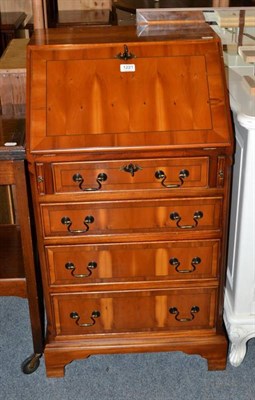 Lot 1221 - A reproduction yew wood bureau with fully fitted interior