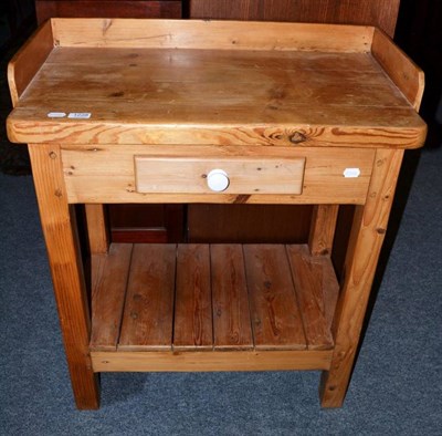 Lot 1228 - A reproduction pine washstand