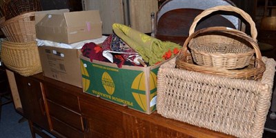 Lot 1233 - Three rugs, three boxes of textiles and a quantity of wicker baskets (qty)