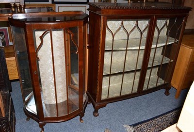 Lot 1235 - A mahogany glazed vitrine cabinet together with a smaller example (2)