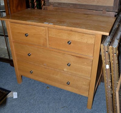 Lot 1236 - A modern light oak three height chest of drawers