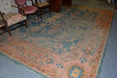 Lot 1244 - A large multi-coloured carpet, with floral panels to the borders and a central turquoise ground...