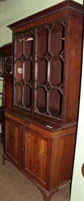 Lot 1260 - A George III mahogany astragal glazed bookcase cabinet