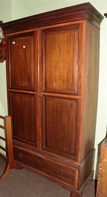 Lot 1270 - A 19th century crossbanded and inlaid mahogany four panel two drawer wardrobe, with base drawer