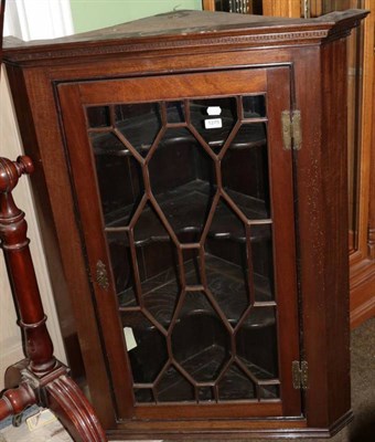 Lot 1275 - A George III mahogany astragal glazed hanging corner cupboard