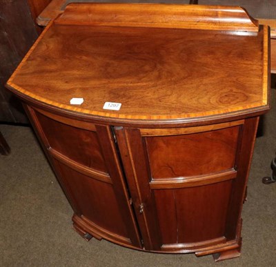 Lot 1297 - A crossbanded mahogany bow fronted two door cabinet