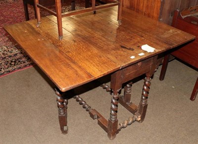 Lot 1299 - A late Victorian oak gateleg table