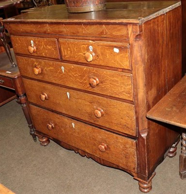 Lot 1301 - A George III oak and mahogany five height chest of drawers