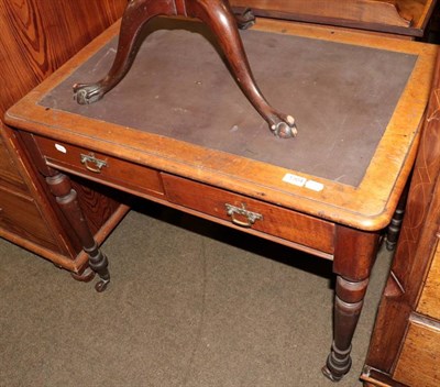 Lot 1304 - A 19th century leather inset walnut writing table, fitted with two drawers (one stamped 9422)