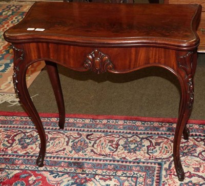 Lot 1307 - A Victorian mahogany fold over card table